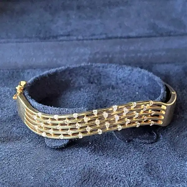 18ct Gold and Diamond Bangle-18ct-yellow-gold-diamond-wave-bangle.webp