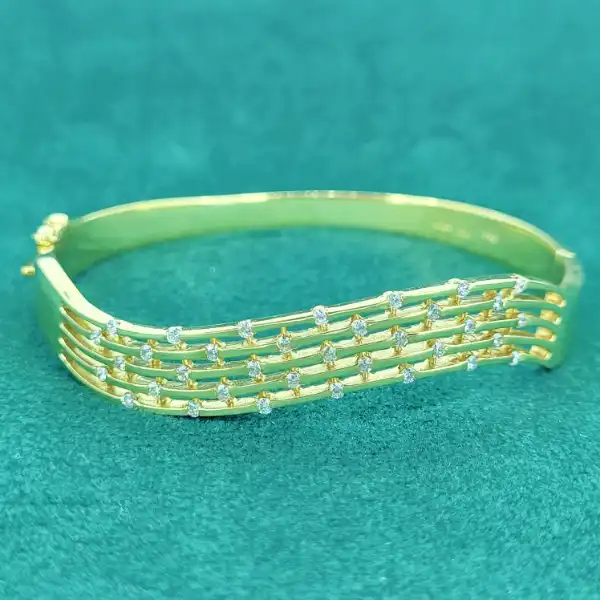 18ct Gold and Diamond Bangle-18ct-yellow-gold-diamond-wave-bangle.webp