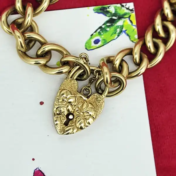 Date 1951! Solid 9ct Gold Charm Bracelet-9ct-gold-charm-bracelet-with-floral-padlock.webp