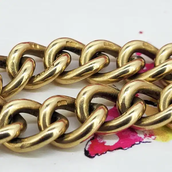 Date 1951! Solid 9ct Gold Charm Bracelet-9ct-gold-charm-bracelet-with-floral-padlock.webp
