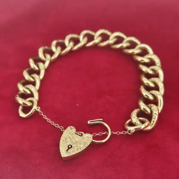 9ct Yellow Gold Chunky Charm Bracelet-9ct-yellow-gold-hollow-charm-bracelet-engraved-padlock.webp