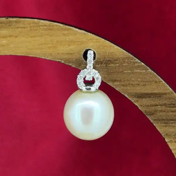 Pearl and Diamond earring in 18ct White Gold-18ct-white-gold-pink-pearl-studs-with-diamonds.webp