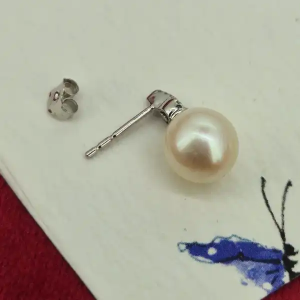 Pearl and Diamond earring in 18ct White Gold-18ct-white-gold-pink-pearl-studs-with-diamonds.webp