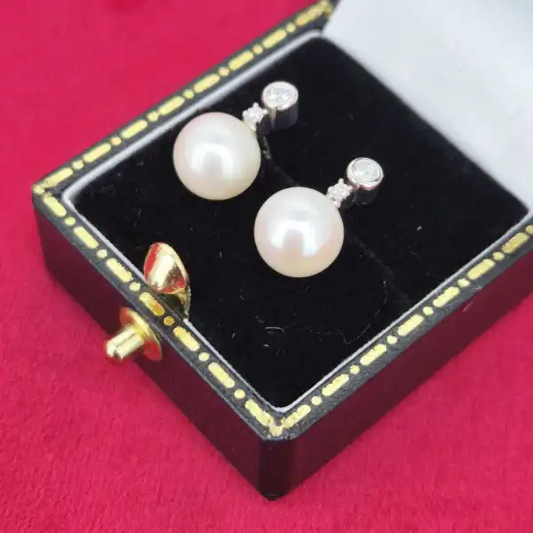 Pearl and Diamond earring in 18ct White Gold-pearl-diamond-studs-in-18ct-white-gold.webp