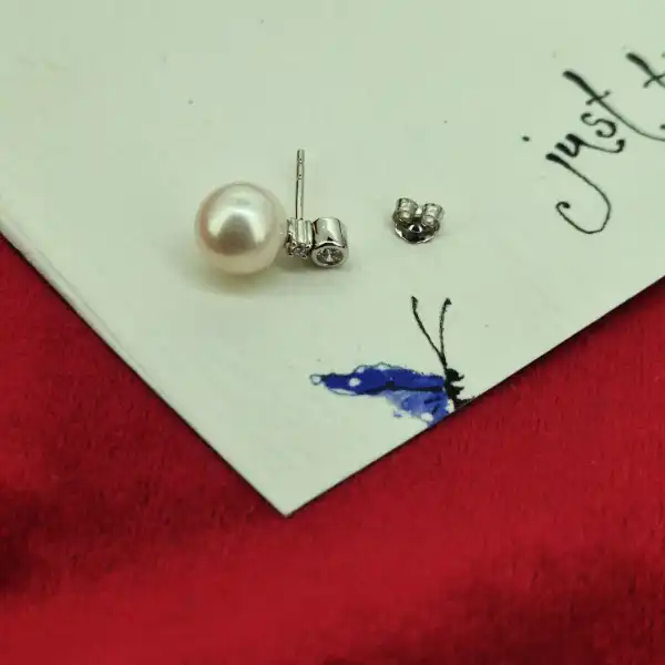Pearl and Diamond earring in 18ct White Gold-pearl-diamond-studs-in-18ct-white-gold.webp