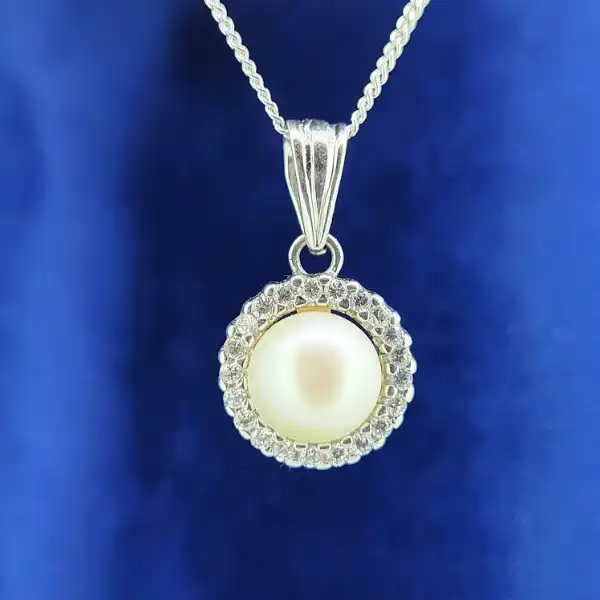 18ct Gold Pearl and Diamond Necklace-18ct-pearl-and-diamond-halo-necklace.webp