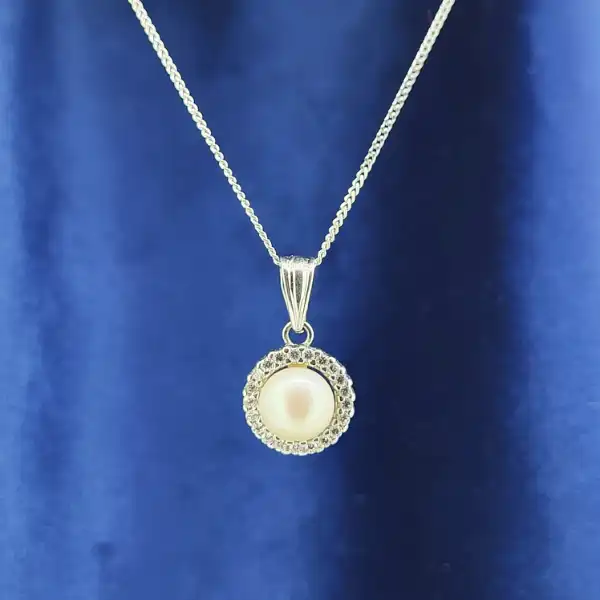 18ct Gold Pearl and Diamond Necklace-18ct-pearl-and-diamond-halo-necklace.webp