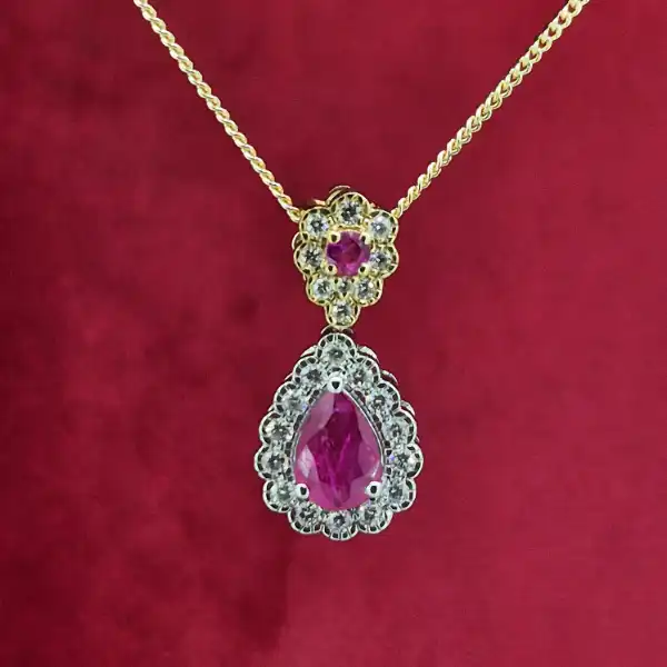 18ct Gold Ruby & Diamond Pendant-18ct-ruby-and-diamond-pear-shape-halo-pendant.webp