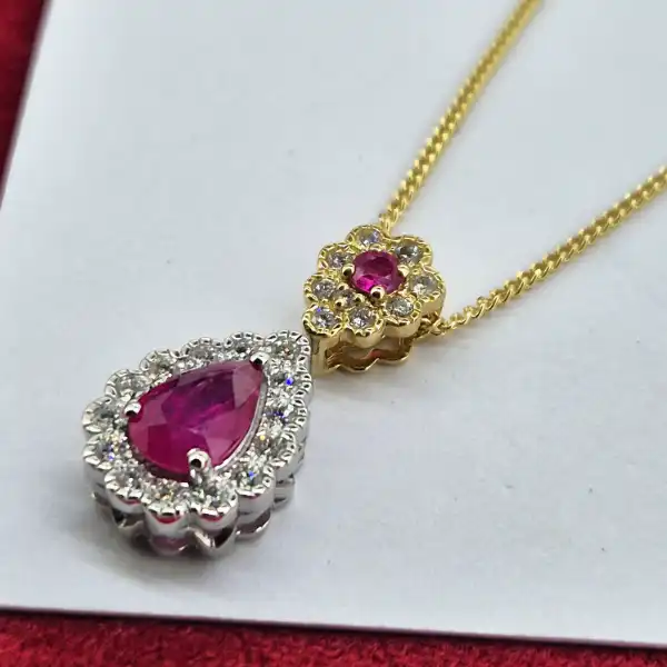18ct Gold Ruby & Diamond Pendant-18ct-ruby-and-diamond-pear-shape-halo-pendant.webp