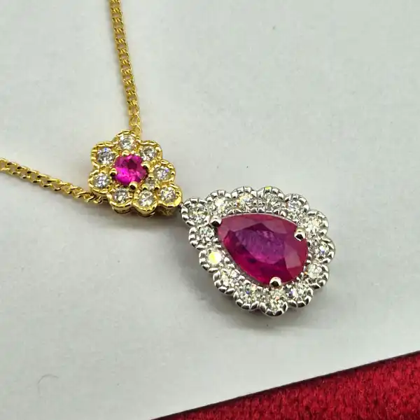 18ct Gold Ruby & Diamond Pendant-18ct-ruby-and-diamond-pear-shape-halo-pendant.webp