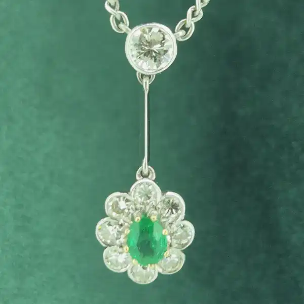 Handmade Diamond and Emerald Pendant-18ct-white-gold-drop-emerald-diamond-daisy-pendant.webp