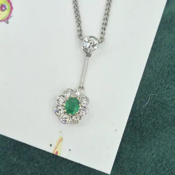 Handmade Diamond and Emerald Pendant-18ct-white-gold-drop-emerald-diamond-daisy-pendant.webp