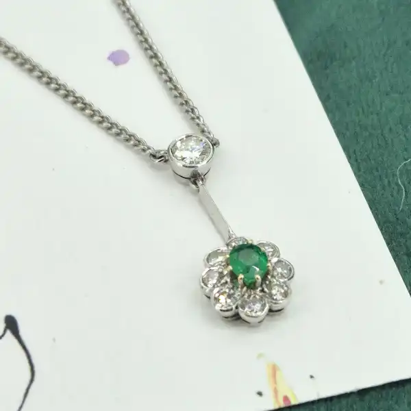 Handmade Diamond and Emerald Pendant-18ct-white-gold-drop-emerald-diamond-daisy-pendant.webp