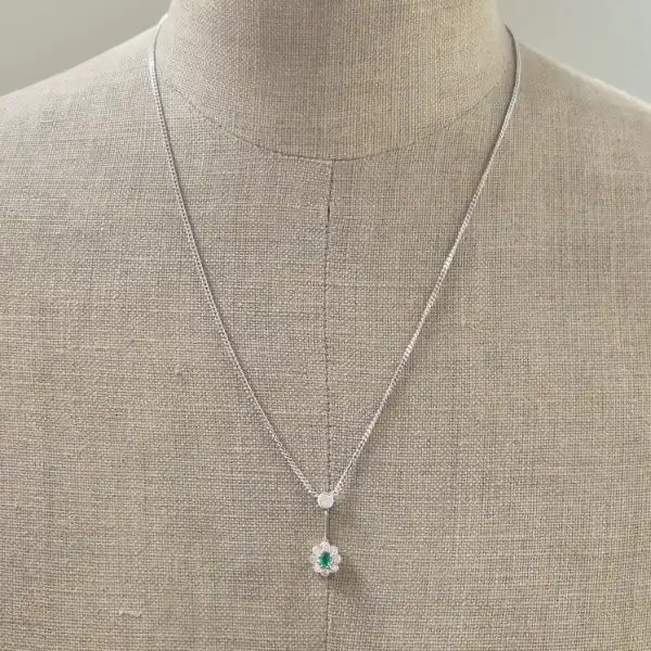 Handmade Diamond and Emerald Pendant-18ct-white-gold-drop-emerald-diamond-daisy-pendant.webp