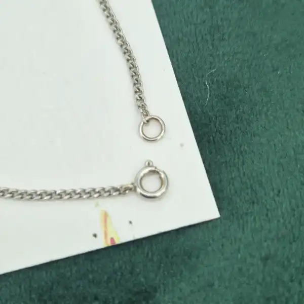 Handmade Diamond and Emerald Pendant-18ct-white-gold-drop-emerald-diamond-daisy-pendant.webp