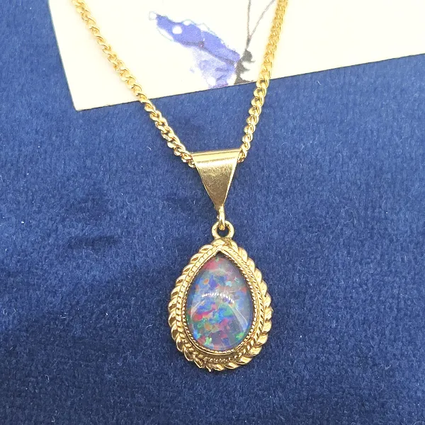 9ct Gold Opal Pendant-9ct-gold-pear-shape-opal-pendant-rope-design.webp