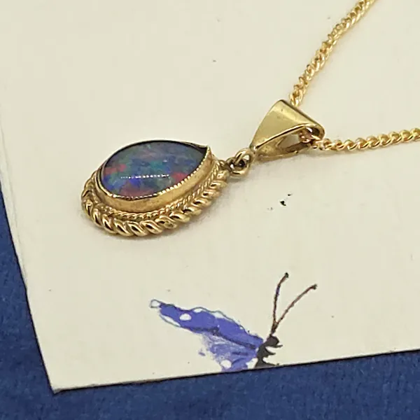 9ct Gold Opal Pendant-9ct-gold-pear-shape-opal-pendant-rope-design.webp