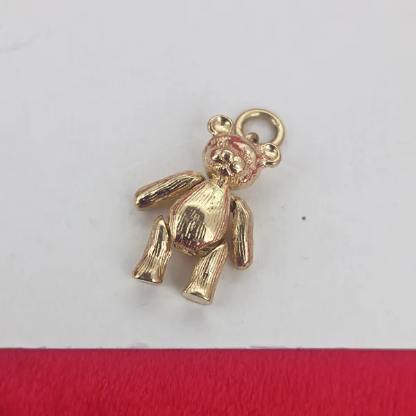 9ct Gold Articulated Teddy Bear Pendant on 16 inch 9ct Yellow Gold Chain- Magnified 