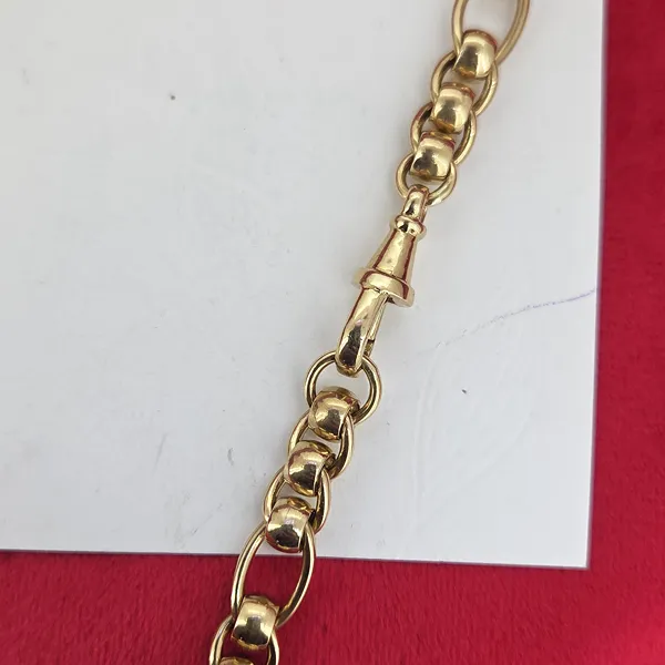 9ct Yellow Gold Rollerball with Figaro Link- Magnified 