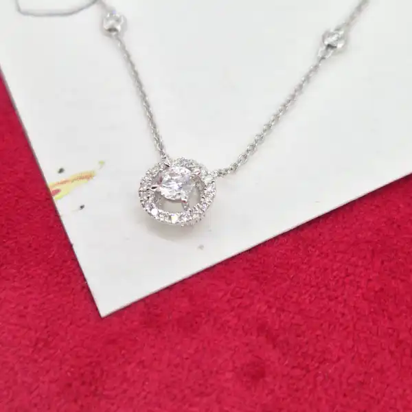 18ct White Gold and Diamond Pendant-diamond-halo-necklace-in-white-gold.webp