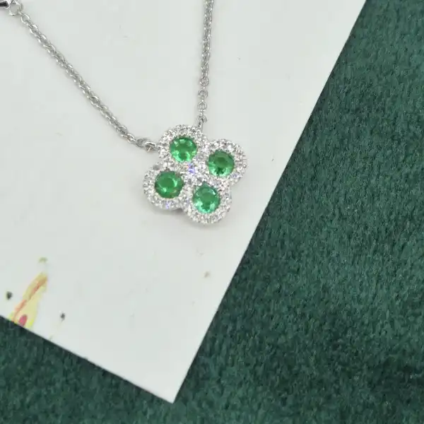 18ct White Gold Diamond and Emerald Clover Style Pendant-emerald-diamond-clover-necklace-white-gold.webp