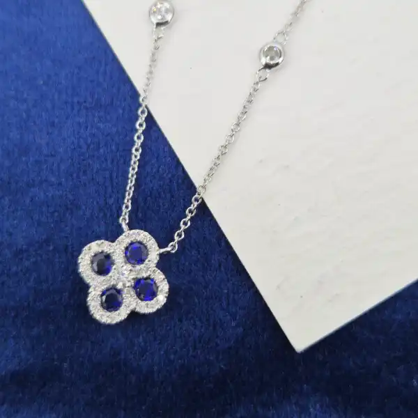 18ct White Gold Diamond and Sapphire Clover Style Pendant-sapphire-diamond-clover-necklace-in-white-gold.webp