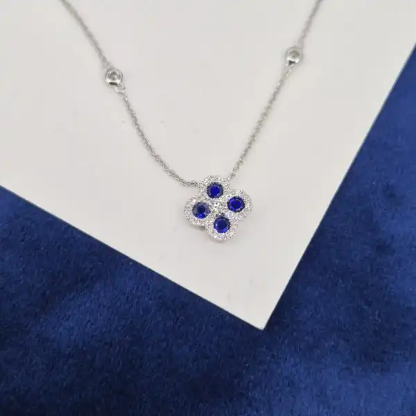 18ct White Gold Diamond and Sapphire Clover Style Pendant-sapphire-diamond-clover-necklace-in-white-gold.webp