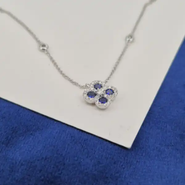 18ct White Gold Diamond and Sapphire Clover Style Pendant-sapphire-diamond-clover-necklace-in-white-gold.webp