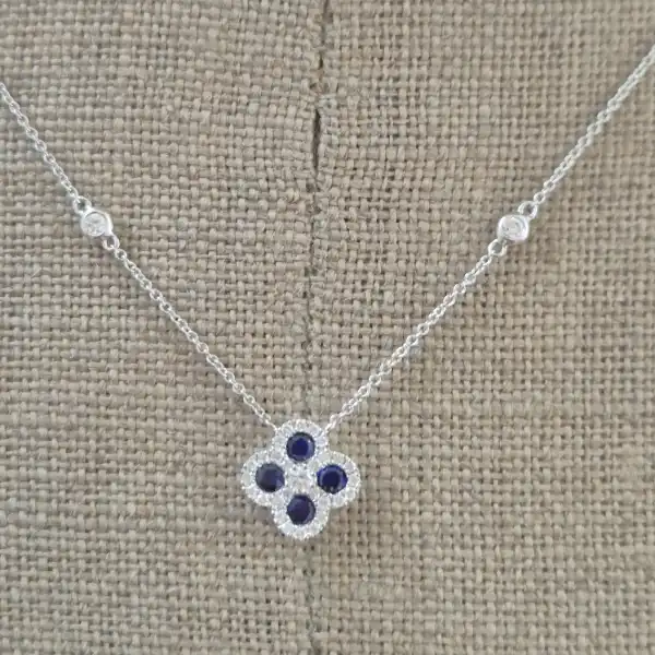 18ct White Gold Diamond and Sapphire Clover Style Pendant-sapphire-diamond-clover-necklace-in-white-gold.webp