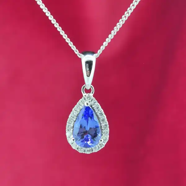 Tanzanite and Diamond Tear Drop Pendant-tanzanite-and-diamond-pear-shape-halo-pendant.webp