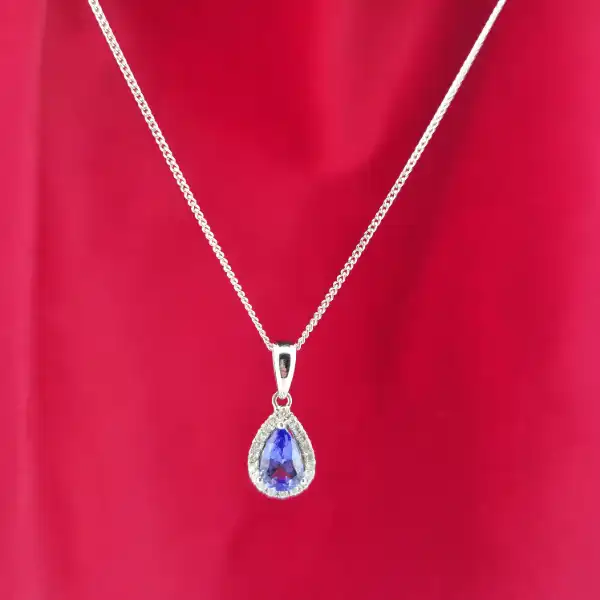 Tanzanite and Diamond Tear Drop Pendant-tanzanite-and-diamond-pear-shape-halo-pendant.webp