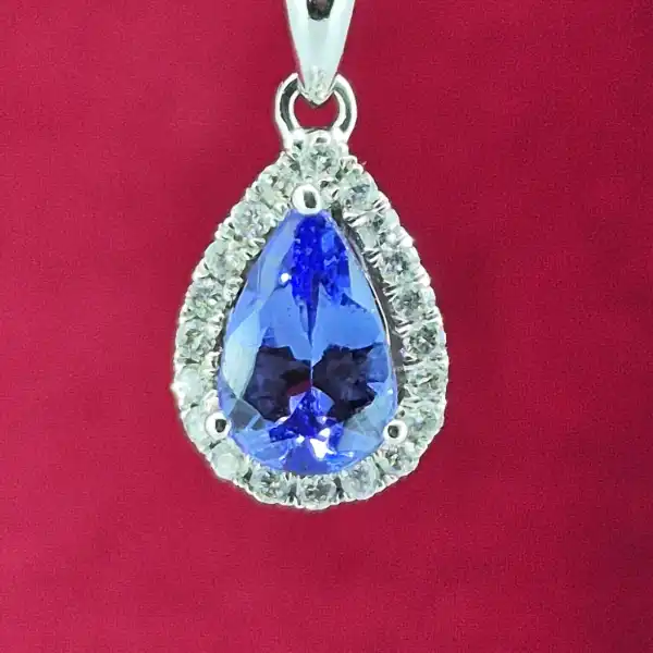 Tanzanite and Diamond Tear Drop Pendant-tanzanite-and-diamond-pear-shape-halo-pendant.webp