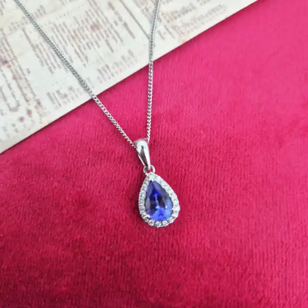 Tanzanite and Diamond Tear Drop Pendant-tanzanite-and-diamond-pear-shape-halo-pendant.webp