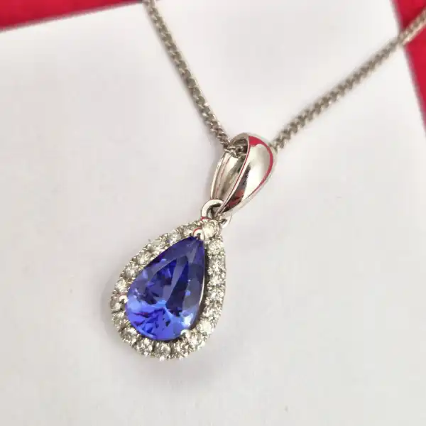 Tanzanite and Diamond Tear Drop Pendant-tanzanite-and-diamond-pear-shape-halo-pendant.webp