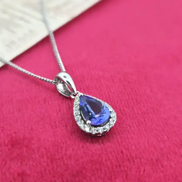 Tanzanite and Diamond Tear Drop Pendant-tanzanite-and-diamond-pear-shape-halo-pendant.webp