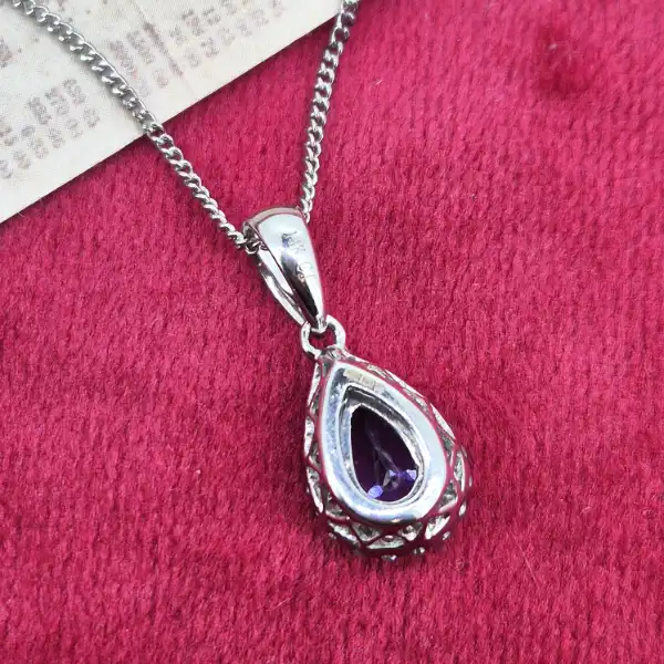 Tanzanite and Diamond Tear Drop Pendant-tanzanite-and-diamond-pear-shape-halo-pendant.webp