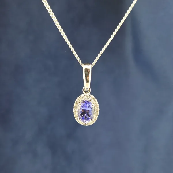 Oval Tanzanite & Diamond Halo Pendant-tanzanite-diamond-halo-pendant-in-white-gold.webp