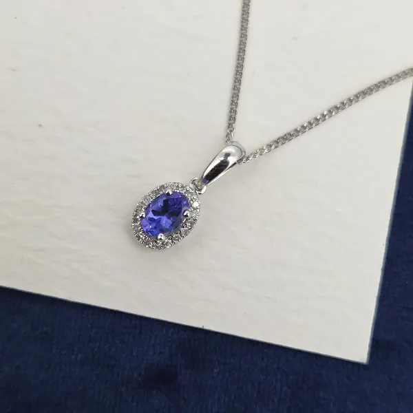 Oval Tanzanite & Diamond Halo Pendant-tanzanite-diamond-halo-pendant-in-white-gold.webp