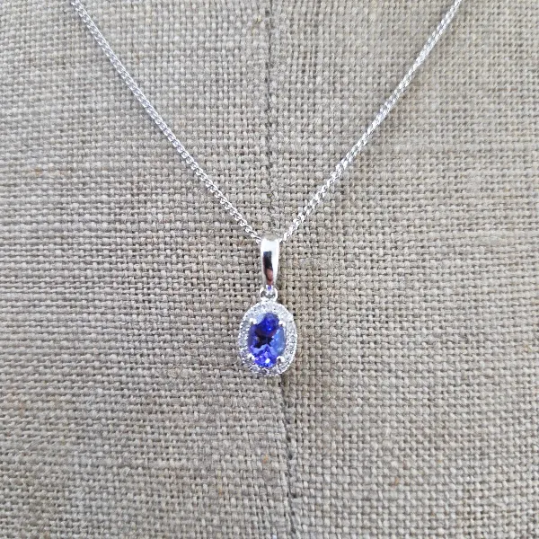 Oval Tanzanite & Diamond Halo Pendant-tanzanite-diamond-halo-pendant-in-white-gold.webp