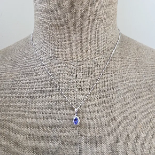 Oval Tanzanite & Diamond Halo Pendant-tanzanite-diamond-halo-pendant-in-white-gold.webp
