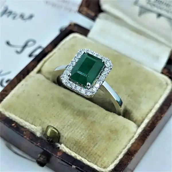 18ct White Gold Emerald and Diamond Halo Ring-18ct-emerald-diamond-halo-ring.webp