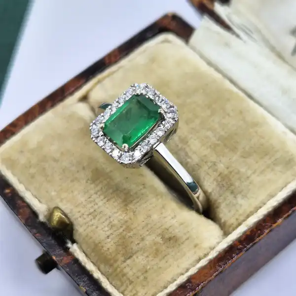 18ct White Gold Emerald and Diamond Halo Ring-18ct-white-emerald-diamond-halo-ring.webp