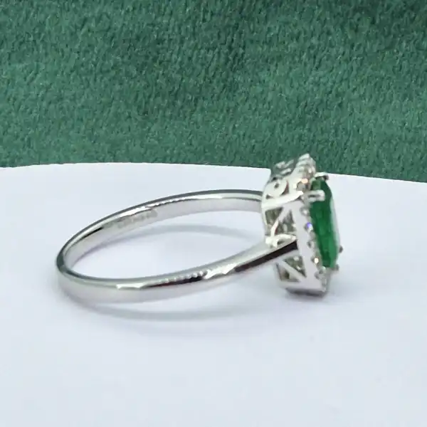 18ct White Gold Emerald and Diamond Halo Ring-18ct-white-emerald-diamond-halo-ring.webp