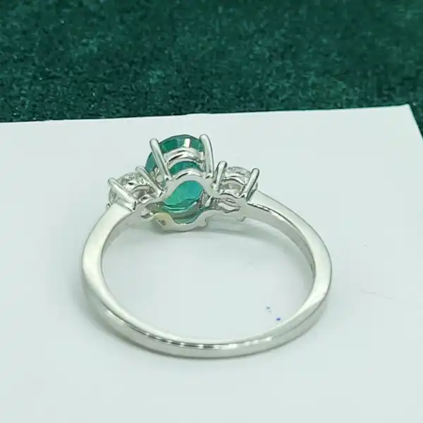 18ct Emerald & Diamond Three Stone Ring-18ct-white-gold-emerald-diamond-trilogy-ring.webp