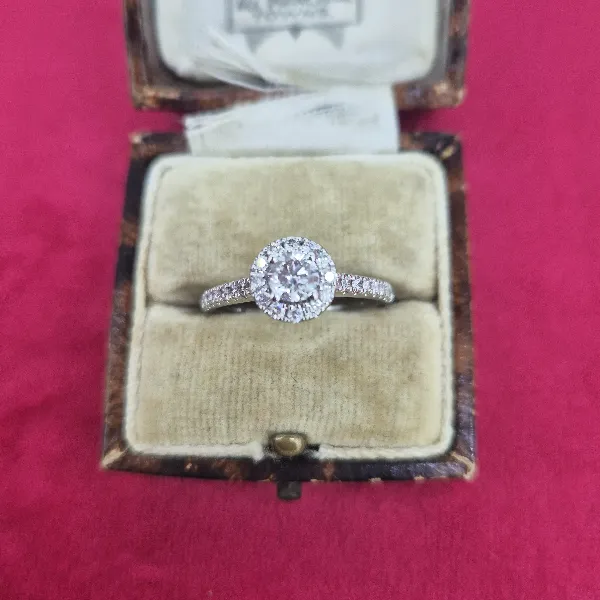 Halo Style Diamond Ring with Diamond Shoulders-18ct-white-gold-round-diamond-halo-ring.webp