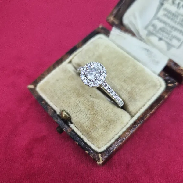 Halo Style Diamond Ring with Diamond Shoulders-18ct-white-gold-round-diamond-halo-ring.webp