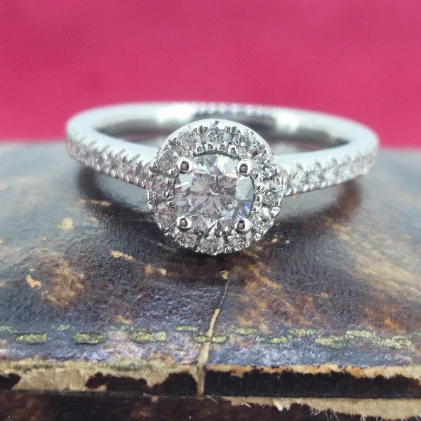 Halo Style Diamond Ring with Diamond Shoulders-18ct-white-gold-round-diamond-halo-ring.webp