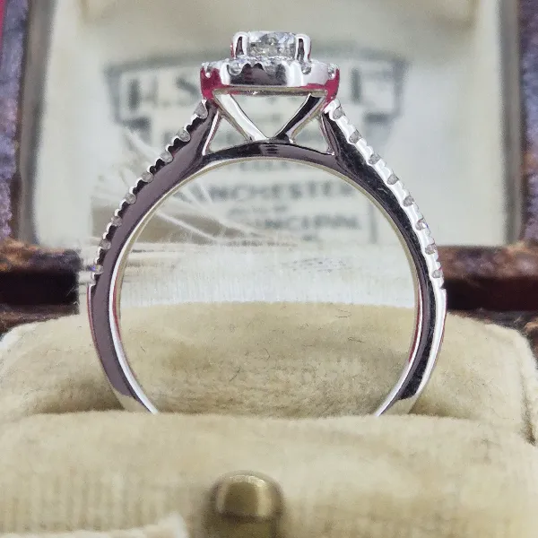 Halo Style Diamond Ring with Diamond Shoulders-18ct-white-gold-round-diamond-halo-ring.webp