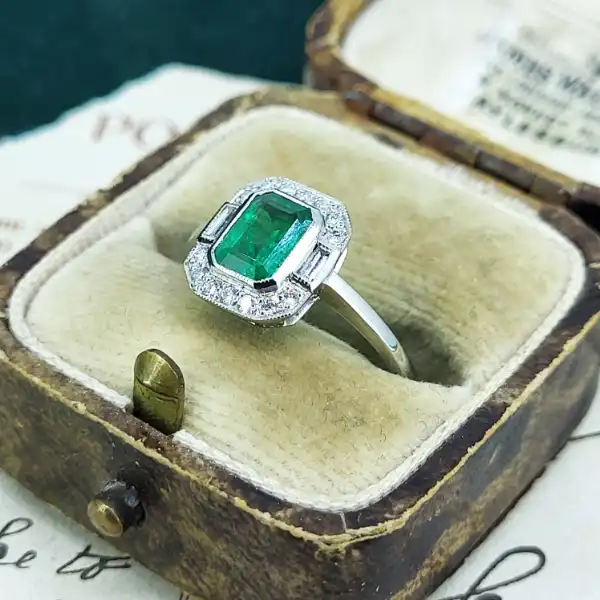 Platinum Emerald and Diamond Ring-art-deco-emerald-cut-emerald-dia-cluster.webp