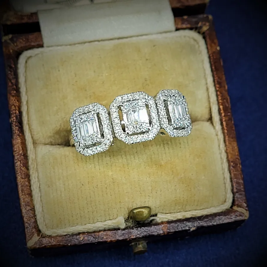 18ct White Gold Illusion Set Diamond Halo Ring-emerald-cut-three-stone.webp